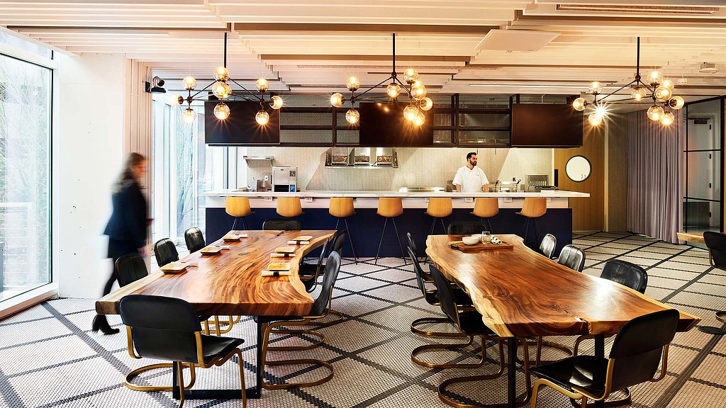 A room with tables and chairs.